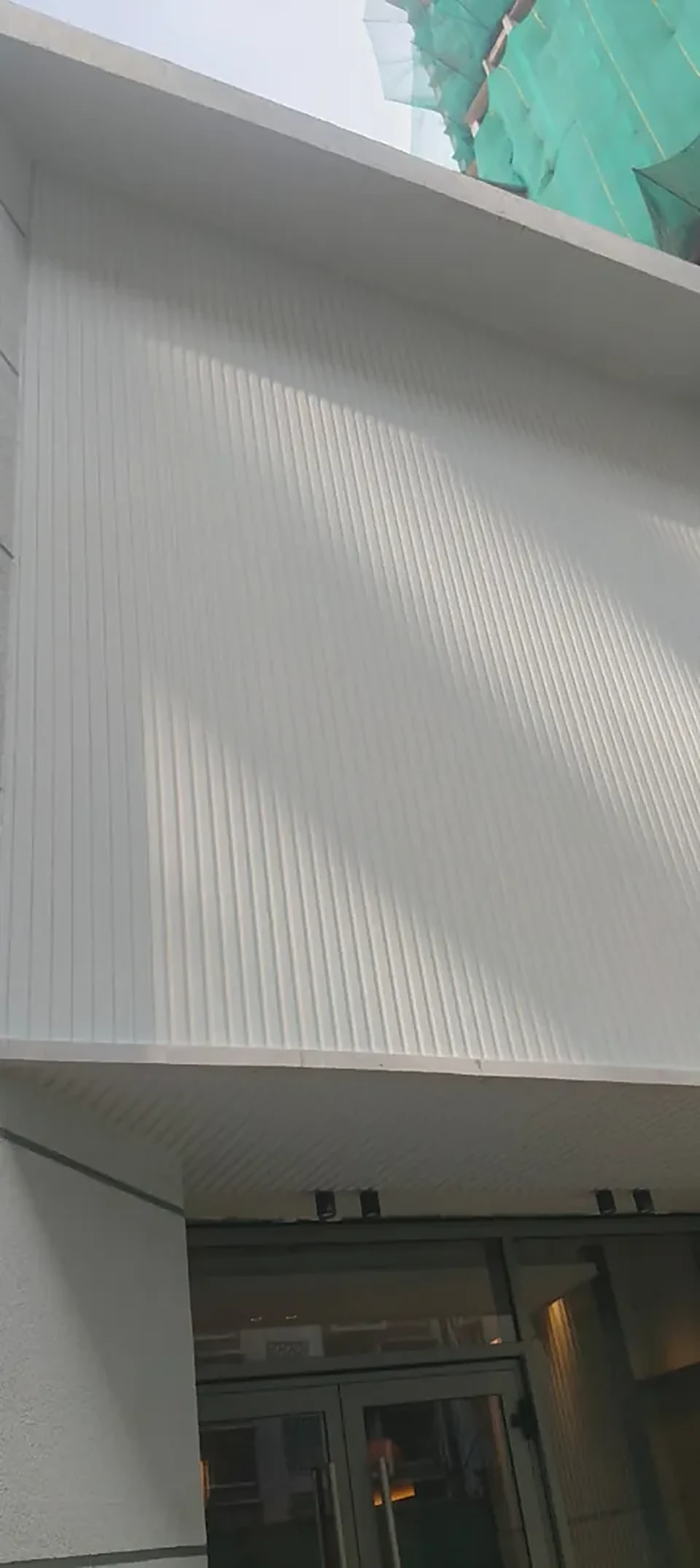 Cement sheet clad soffit at Lodha White City