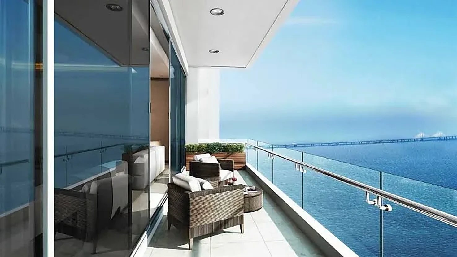 Balcony with glass railing overlooking the sea