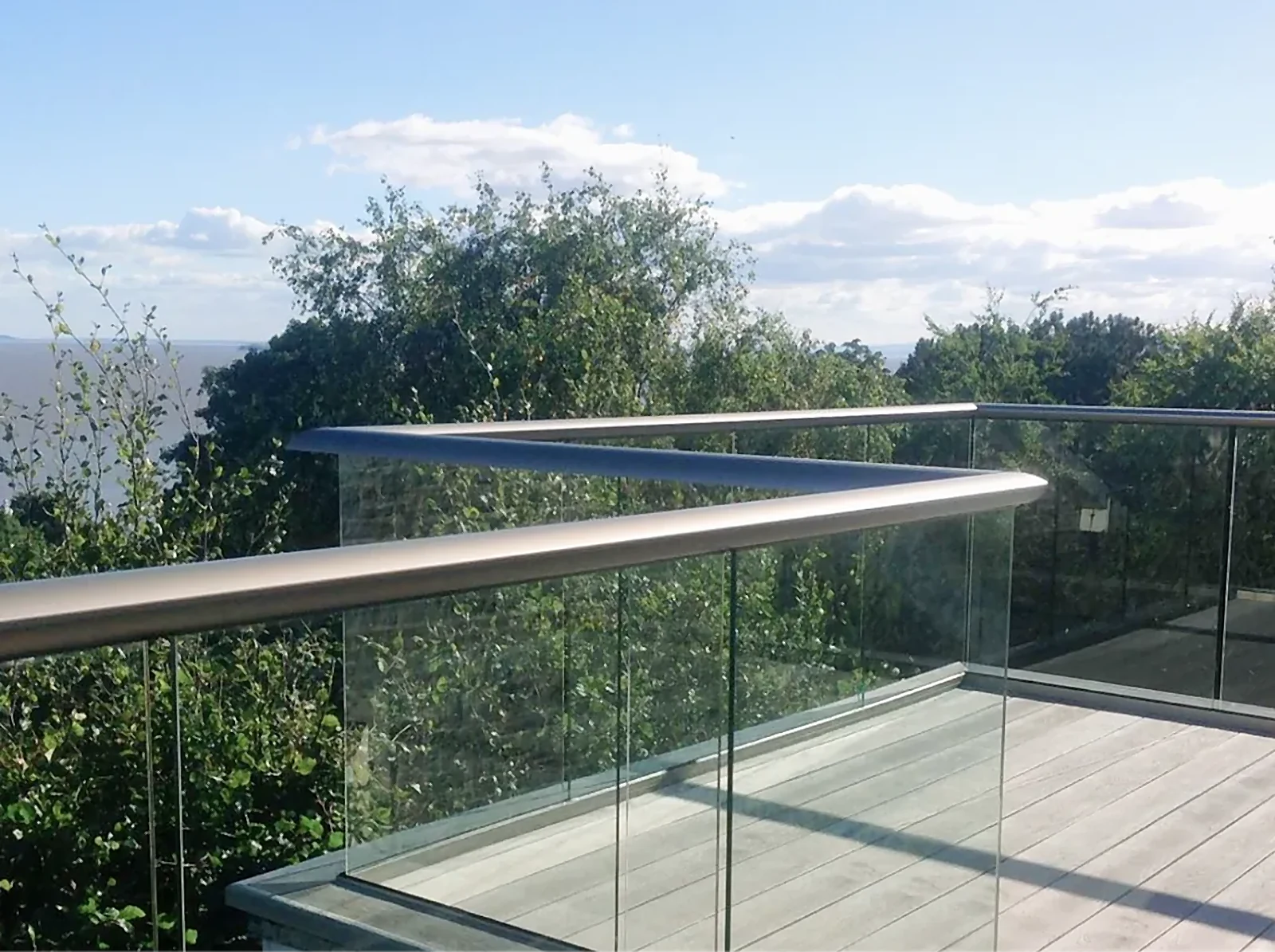 Glass railing on a timber-decked terrace