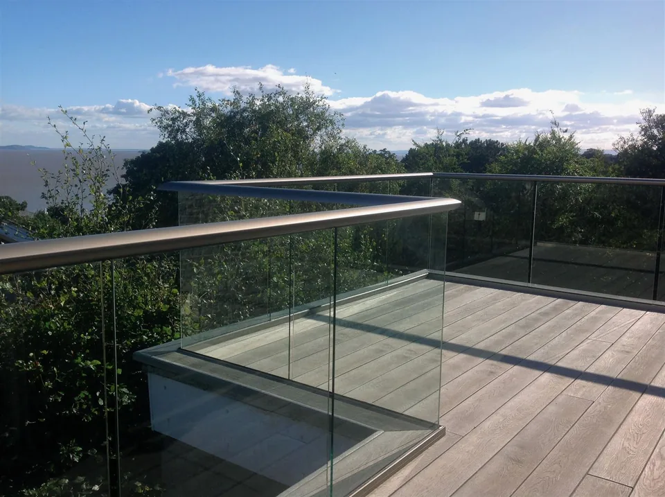 Glass railing on a timber-decked balcony